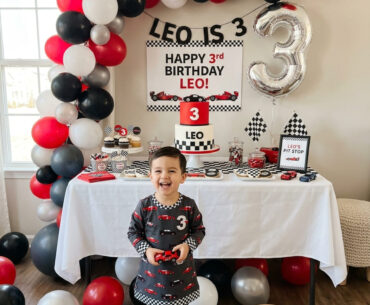Modern race car third birthday party setup for a boy at home