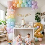 Rainbow second birthday party setup at home with colorful modern decor