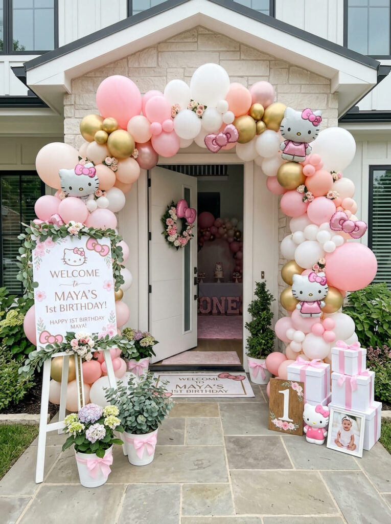 Hello Kitty first birthday entrance with balloons and a welcome sign