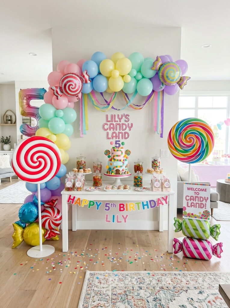 Candy Land fifth birthday decor with oversized candy props used neatly