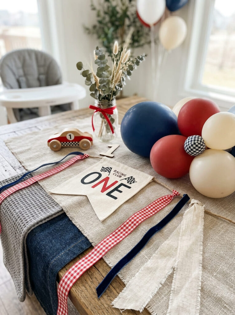 Fabrics and textures used to soften and style a cars first birthday setup