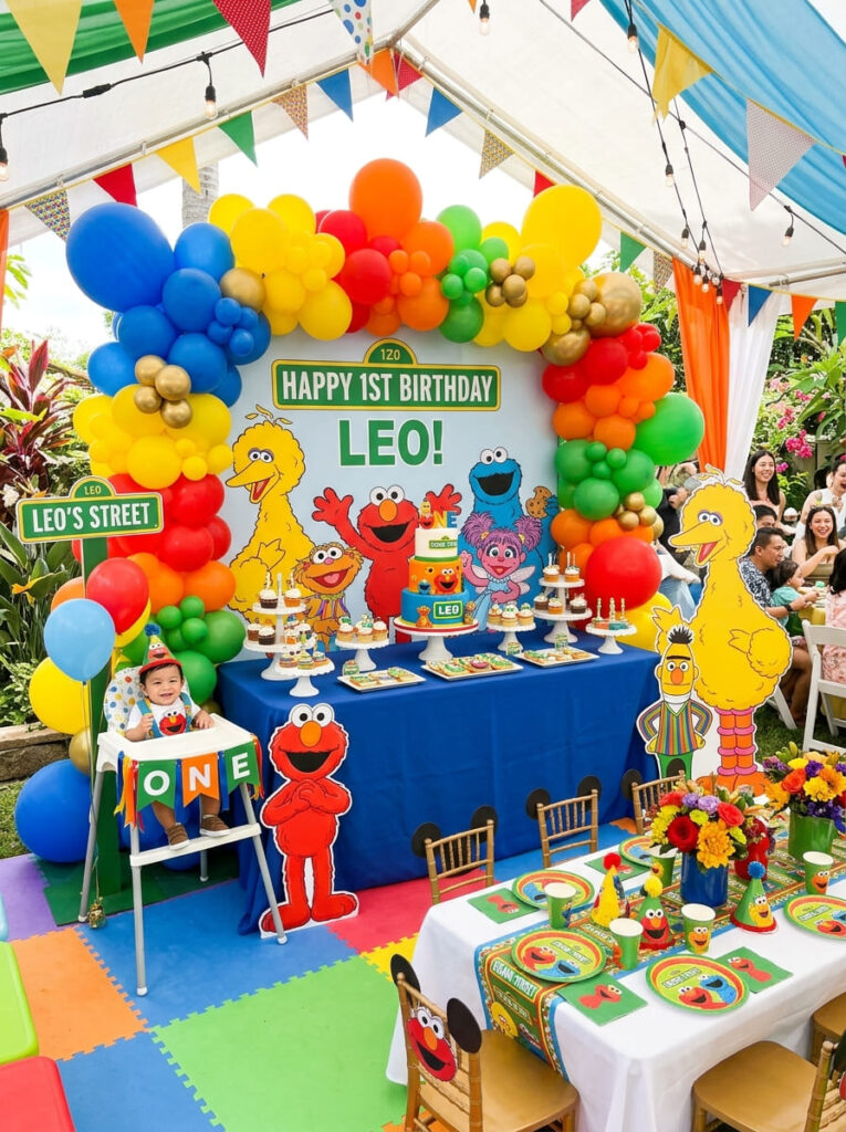 Full Sesame Street first birthday setup with coordinated playful decor