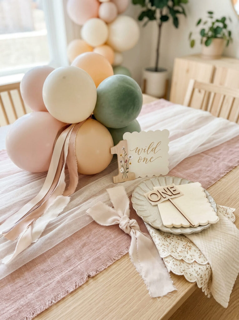 So  textures used to style a polished pastel first birthday setup
