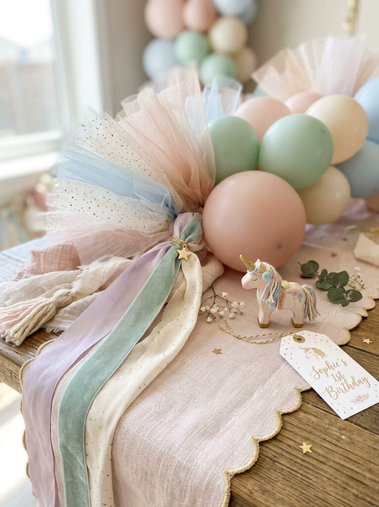 Delicate textures used to style a polished unicorn first birthday setup